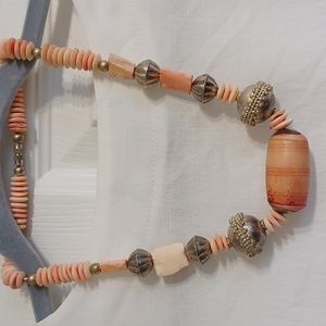Pale peach beaded necklace with accent Silvertone embelished beads.
